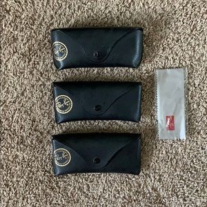 3 empty black Ray Ban sunglass cases